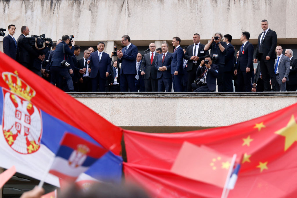 Serbian President Aleksandar Vucic accompanied by Chinese President Xi Jinping addresses people gathered outside the Palace of Serbia during a welcome ceremony in Belgrade, 8 May 2024 (AFP via Getty Images)