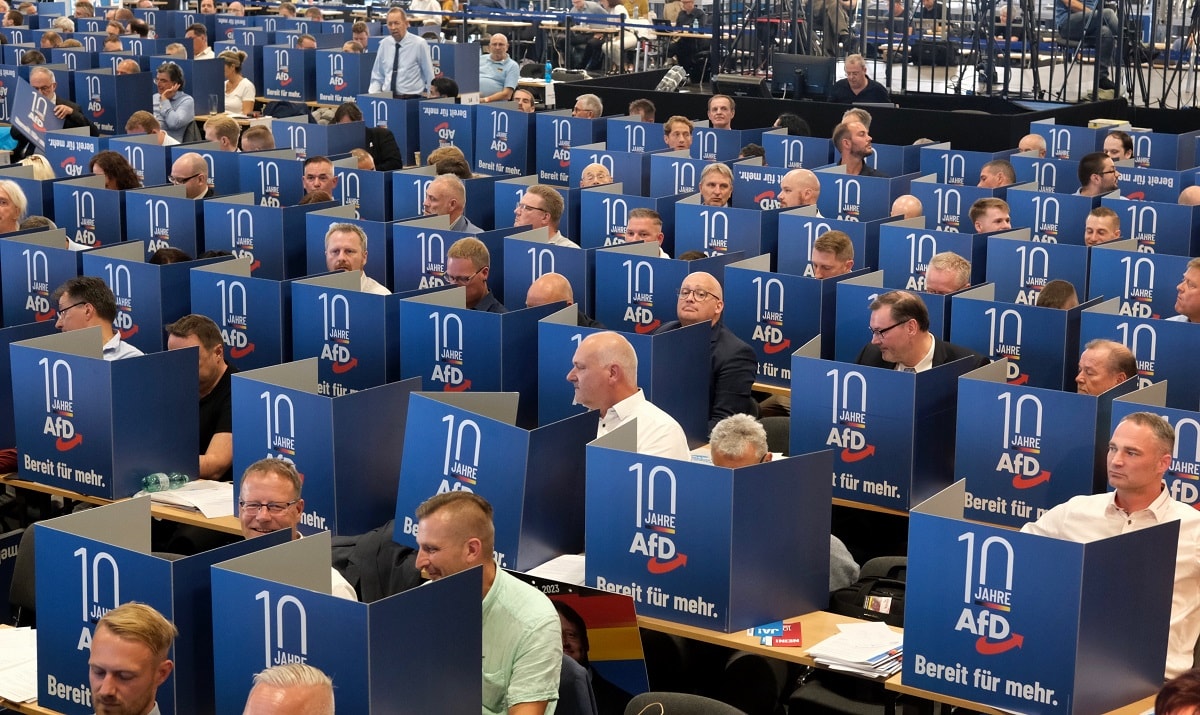 29 July 2023, Saxony-Anhalt, Magdeburg: Delegates cast their votes for the AfD's European election list positions behind voting booths at the European Election Convention at the Magdeburg Trade Fair Center. Photo: Sebastian Willnow/dpa (Photo by Sebastian Willnow/picture alliance via Getty Images)