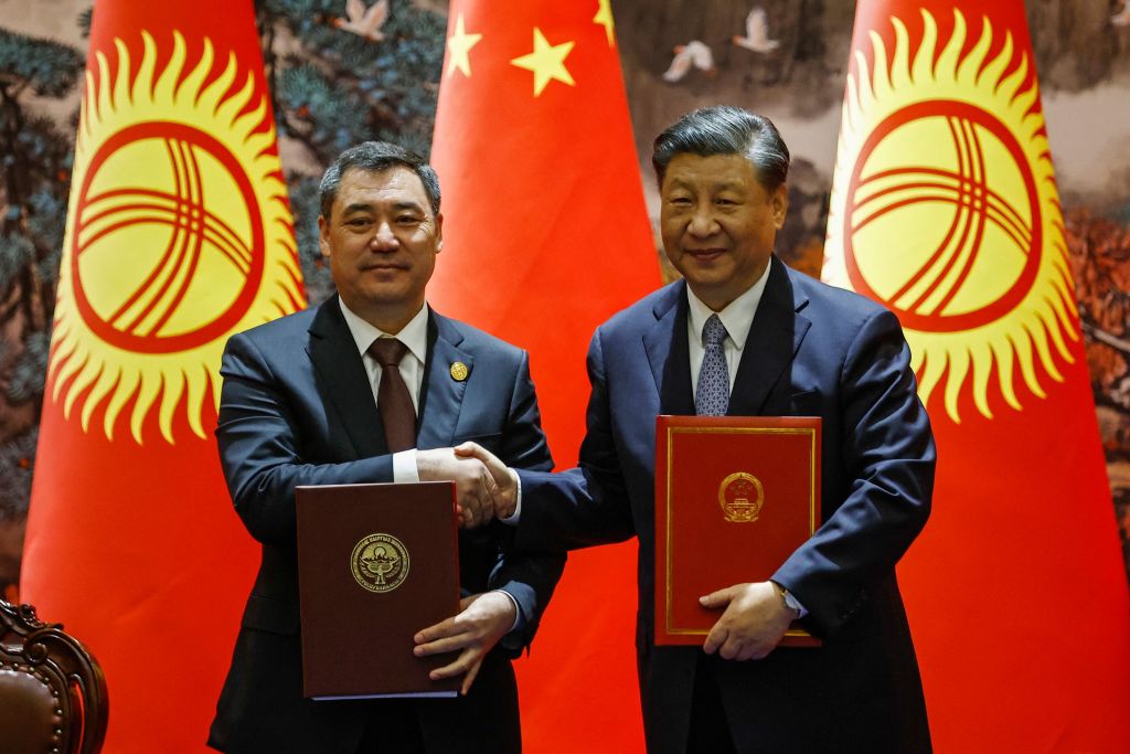 China’s President Xi Jinping, right, and Kyrgyzstan’s President Sadyr Zhaparov ahead of the China-Central Asia Summit in Xi'an in China’s northern Shaanxi province on 18 May 2023 (Florence Lo/AFP via Getty Images)