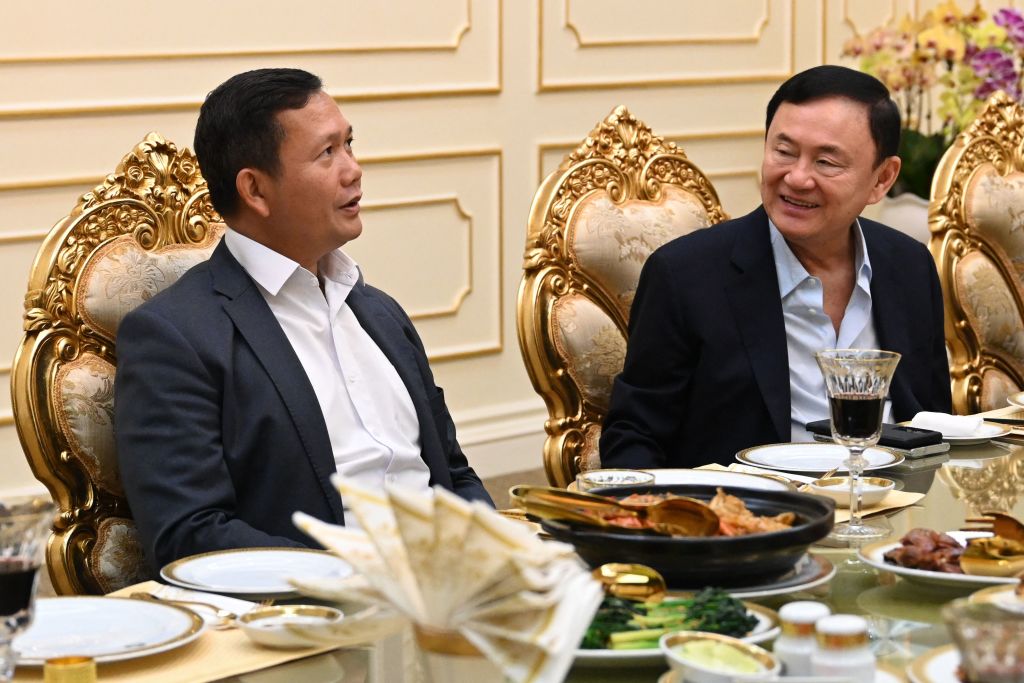 Thailand's former prime minister Thaksin Shinawatra, right, alongside Hun Manet, eldest son of Cambodia's Hun Sen, during an event on 5 August for Hun Sen's birthday in Phnom Penh (STR/AFP via Getty Images)