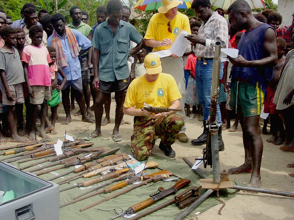 Weapons from the Bougainville Revolutionary Army are collected and recorded at a peace ceremony in southern Bougainville, March 2002 (DFAT)
