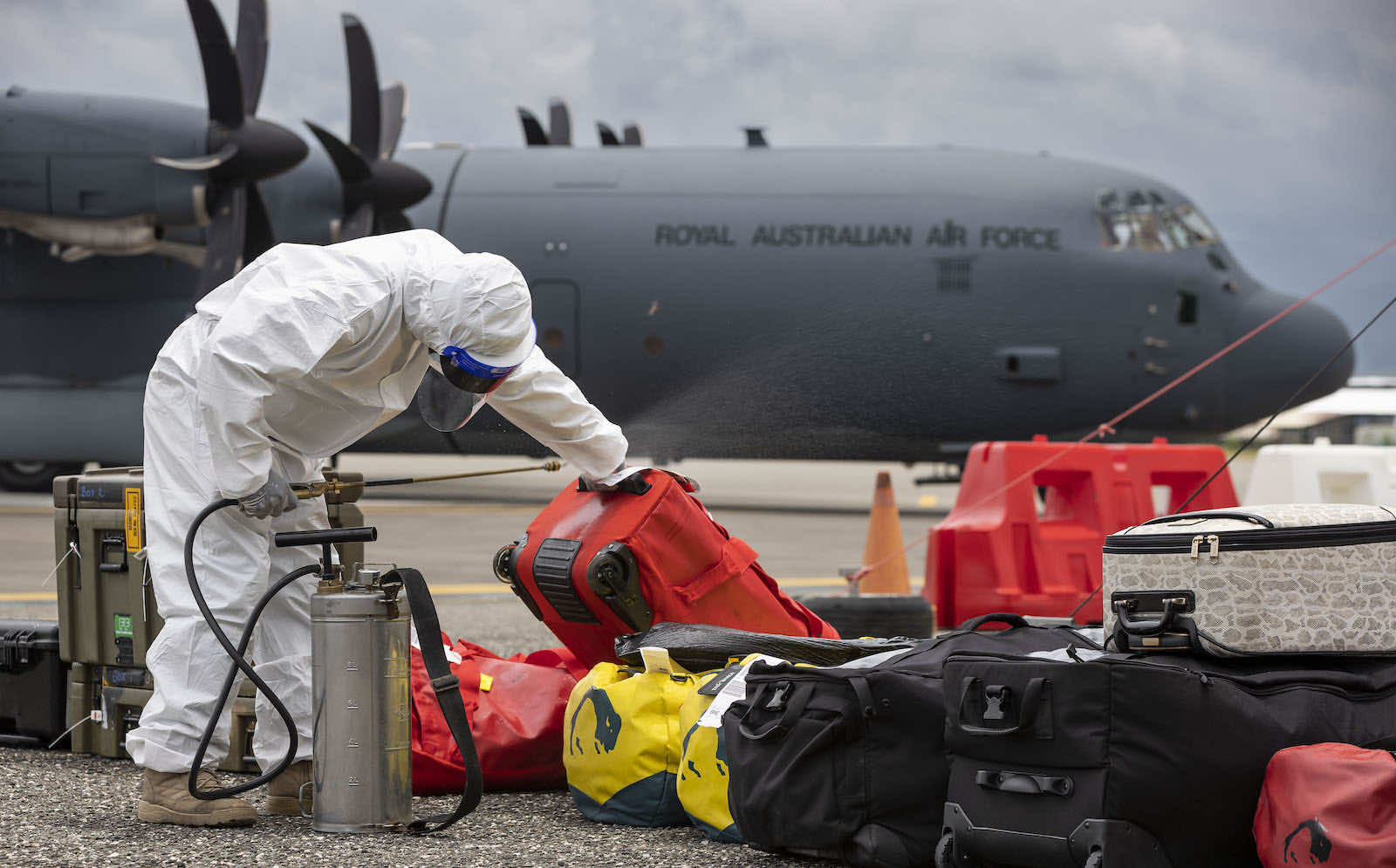 Personal baggage is disinfected at Honiara airport in line with Covid-19 protocols in Solomon Islands following the arrival of an Australian aid flight (Defence Department)