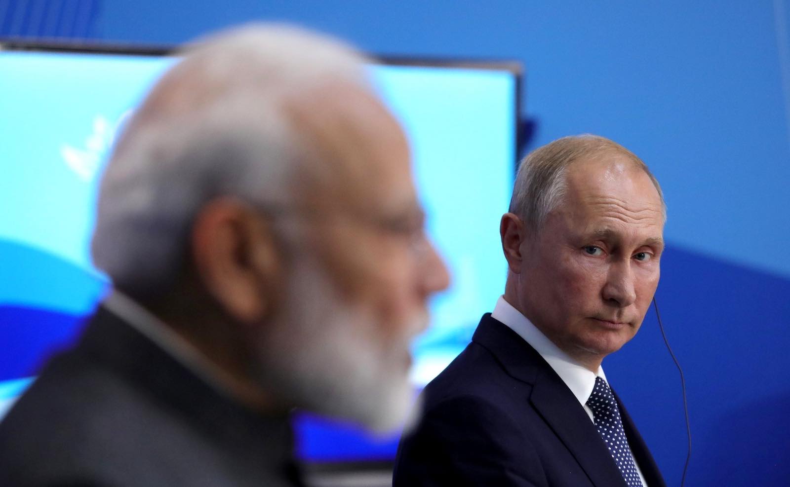 Vladimir Putin listens as Narendra Modi speaks to the media following Russian-Indian talks in 2019 (Kremlin.ru)