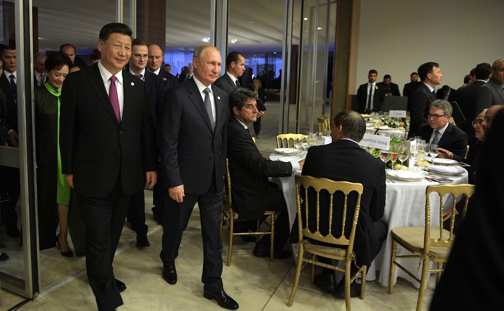 China’s President Xi Jinping and Russia’s President Vladimir Putin at a dinner for the leaders of Russia, India, China and South Africa hosted by the president of Brazil, at the BRICS summit November 2019 in Brasilia. 