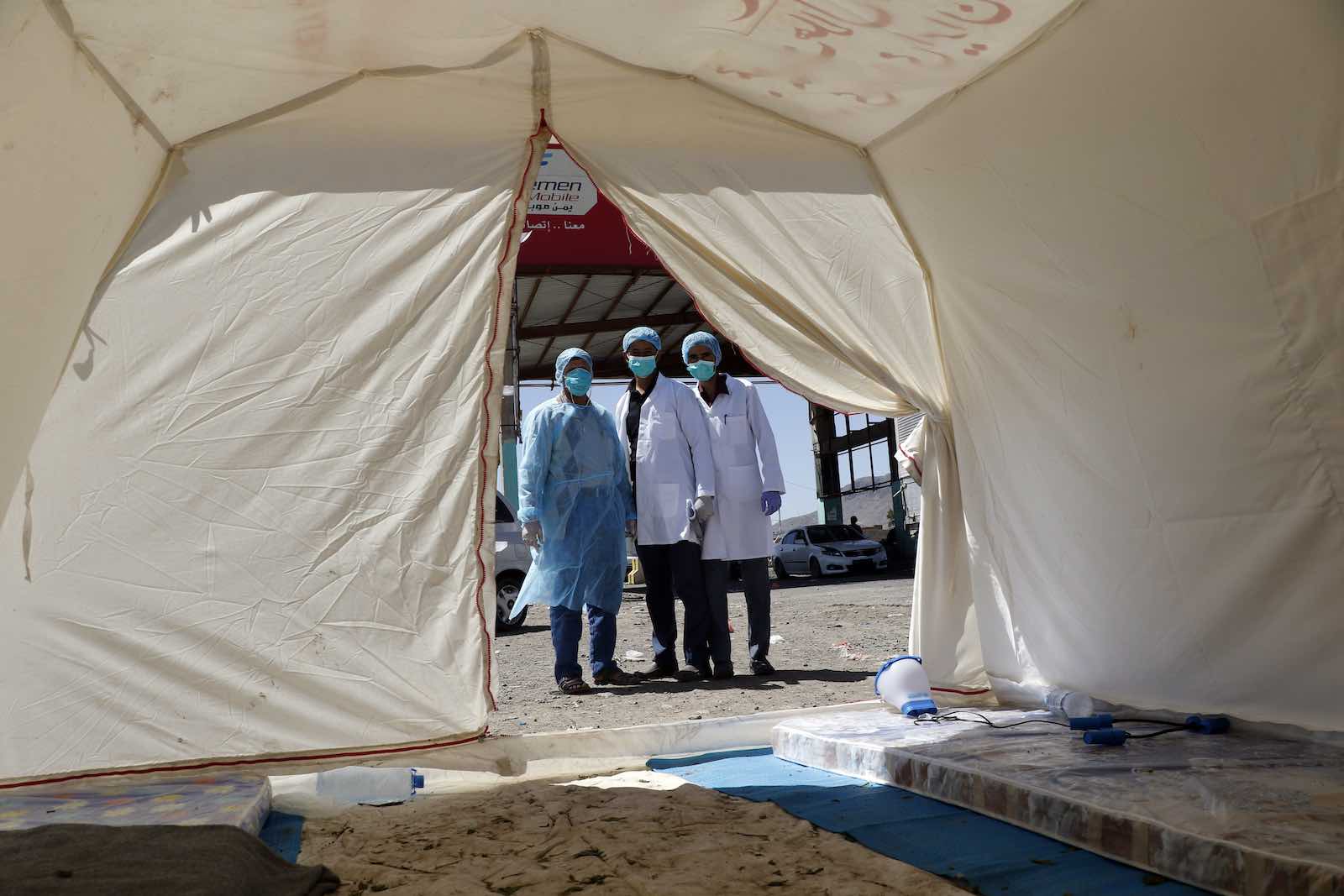 Medical personnel outside a field hospital tent on the outskirts of Sana’a, Yemen, 5 April (Mohammed Hamoud/Getty Images)
