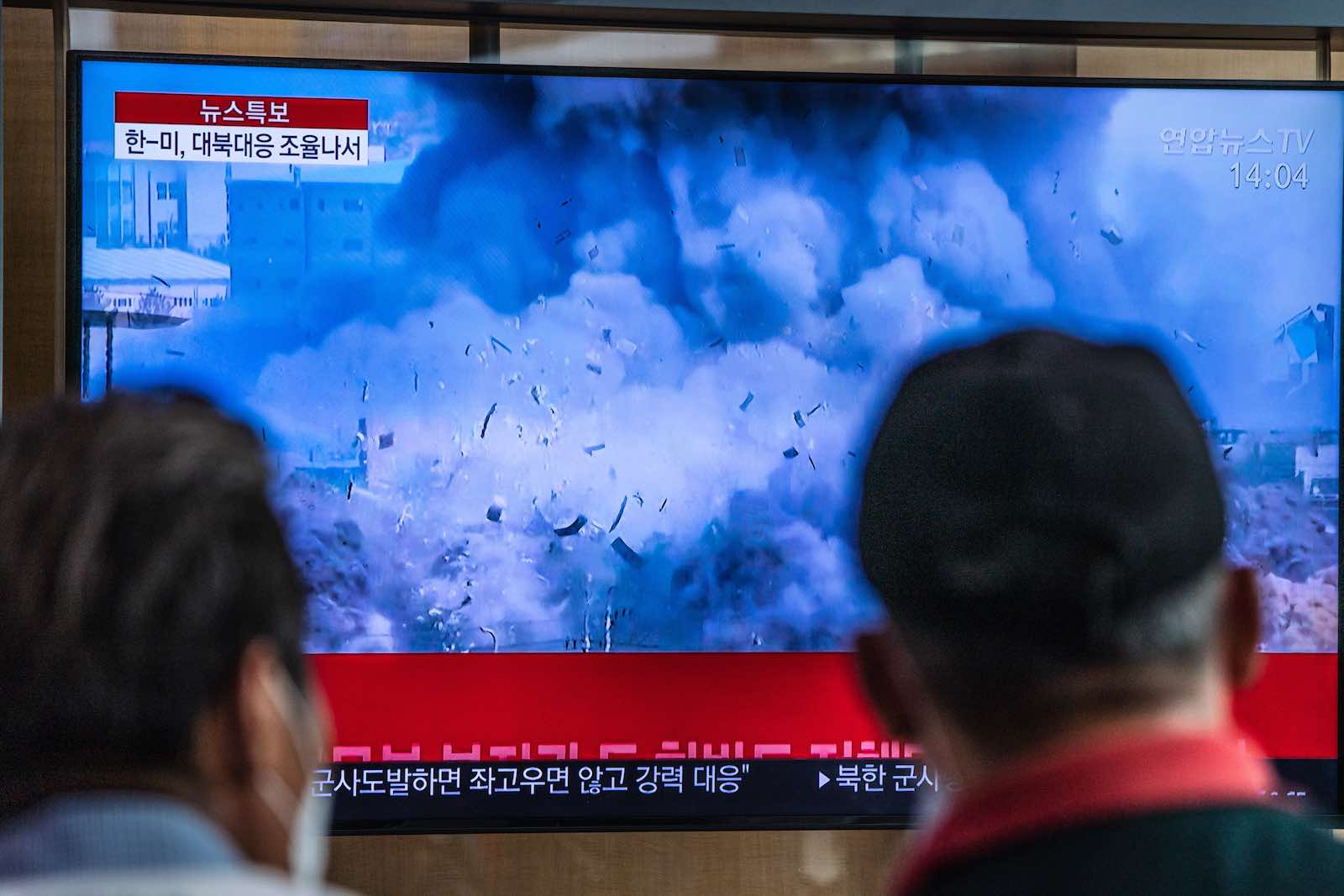 A broadcast of North Korea’s destruction of the liaison office built for talks with South Korea (Simon Shin via Getty Images)