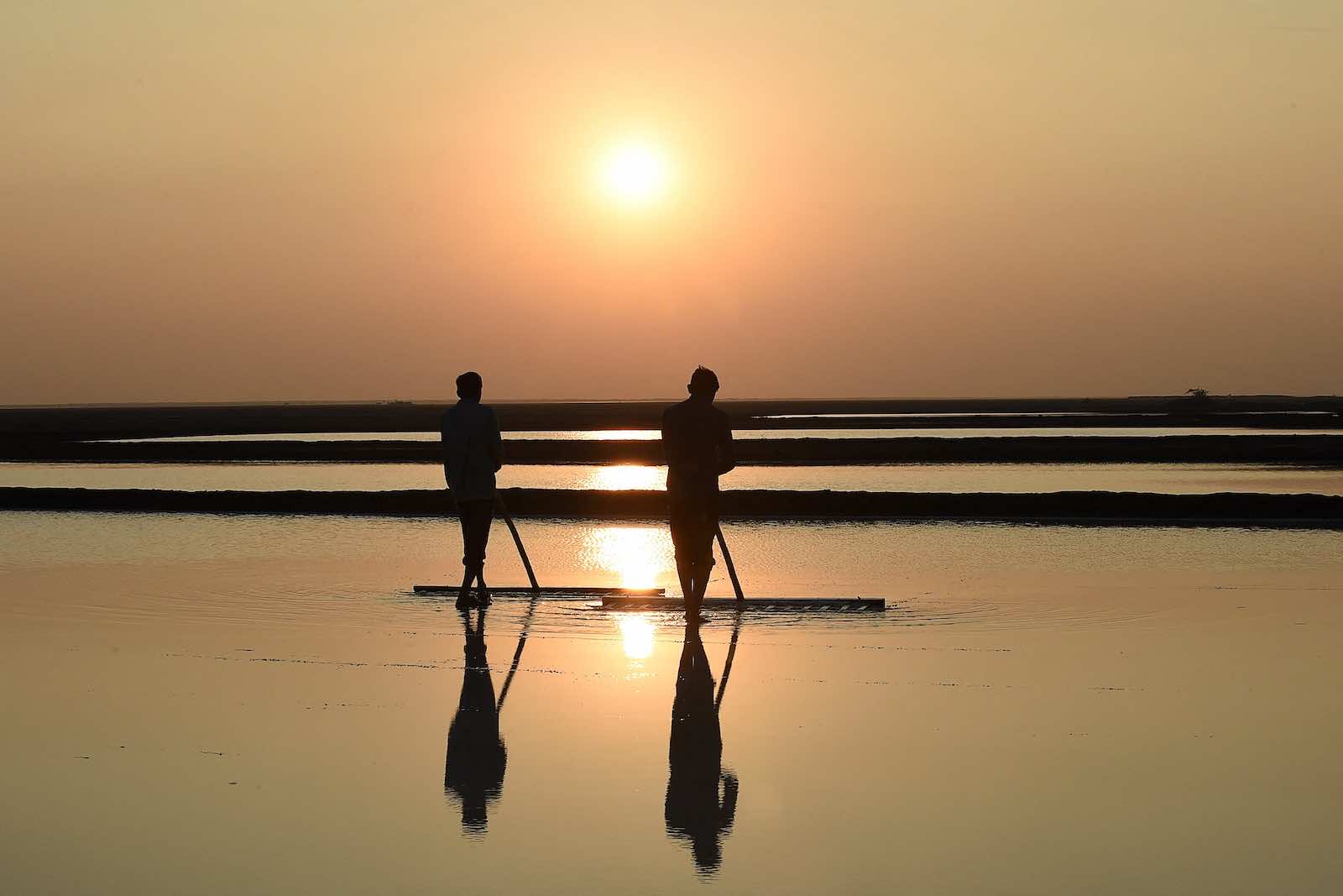 Labourers working on a salt pan at the Little Rann of Kutch region, Gujarat, India (Sam Panthaky/AFP via Getty Images)