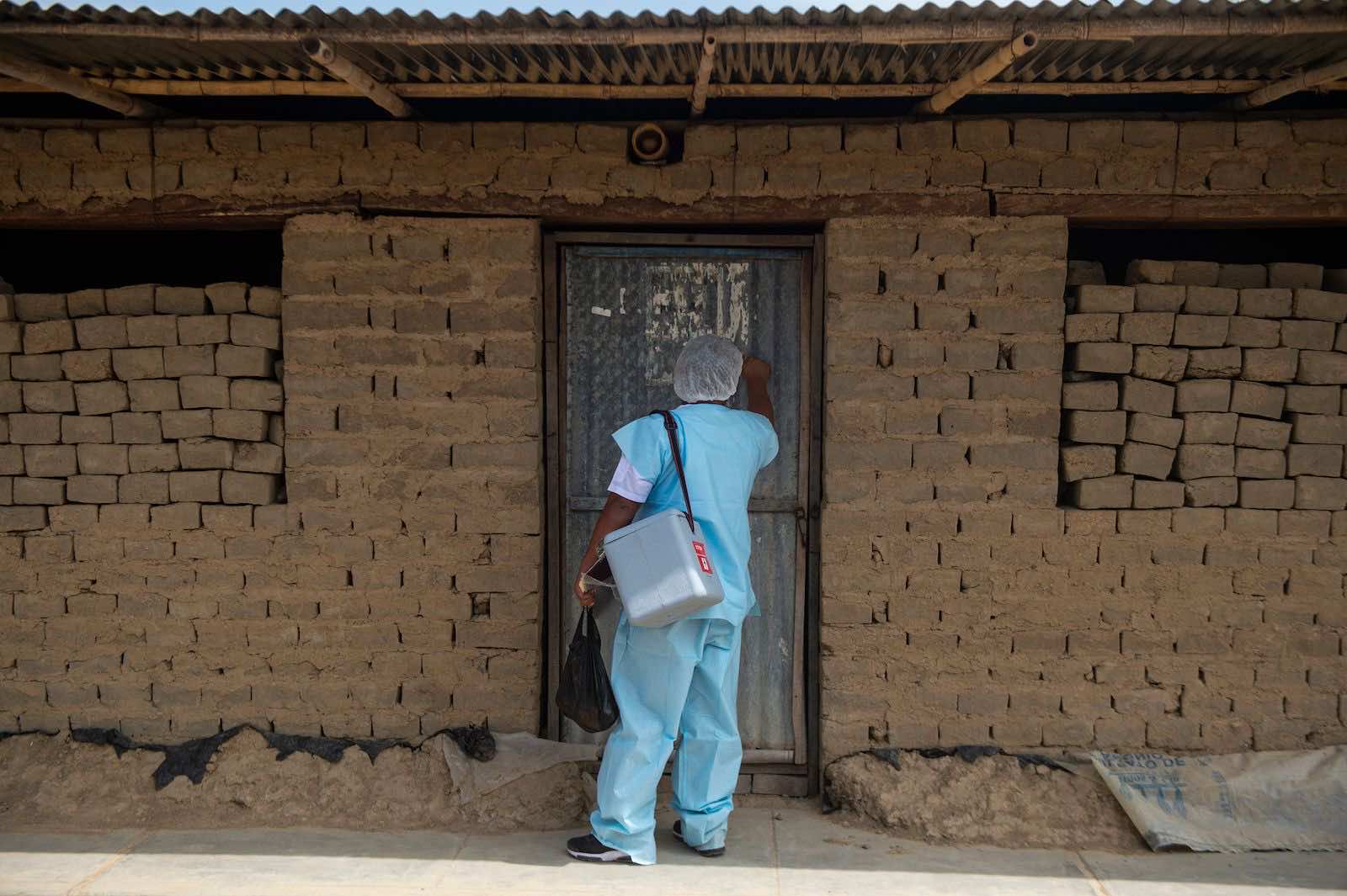 Door-knocking with the Covid-19 vaccine last month in the north of Peru (Ernesto Benavides/AFP via Getty Images)