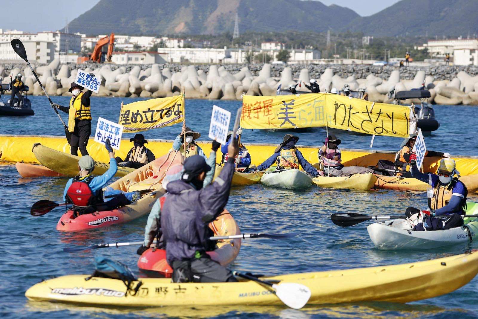 Demonstrators in December protesting land reclamation work for the planned relocation of US Marine Corps Air Station Futenma in the Henoko coastal area of Nago, Okinawa Prefecture, Japan (Kyodo News via Getty Images)