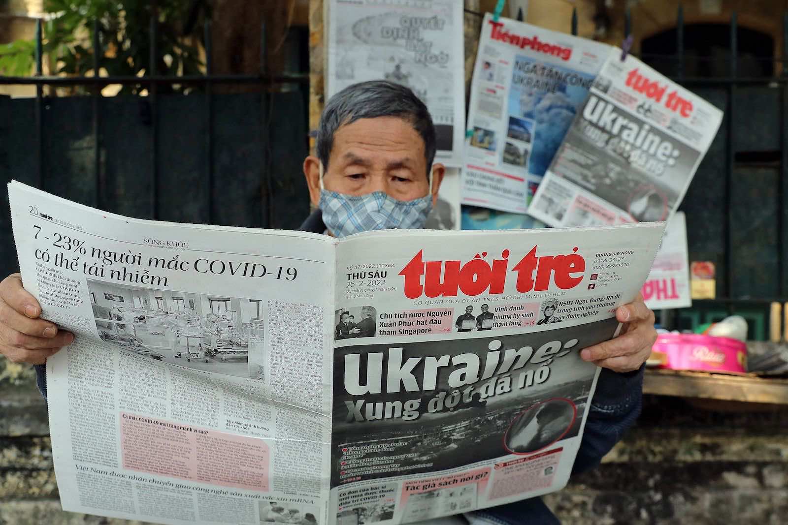 Front page coverage of the Russian invasion of Ukraine at a stall in Hanoi, Vietnam (Nam Nguyen/AFP via Getty Images) 
