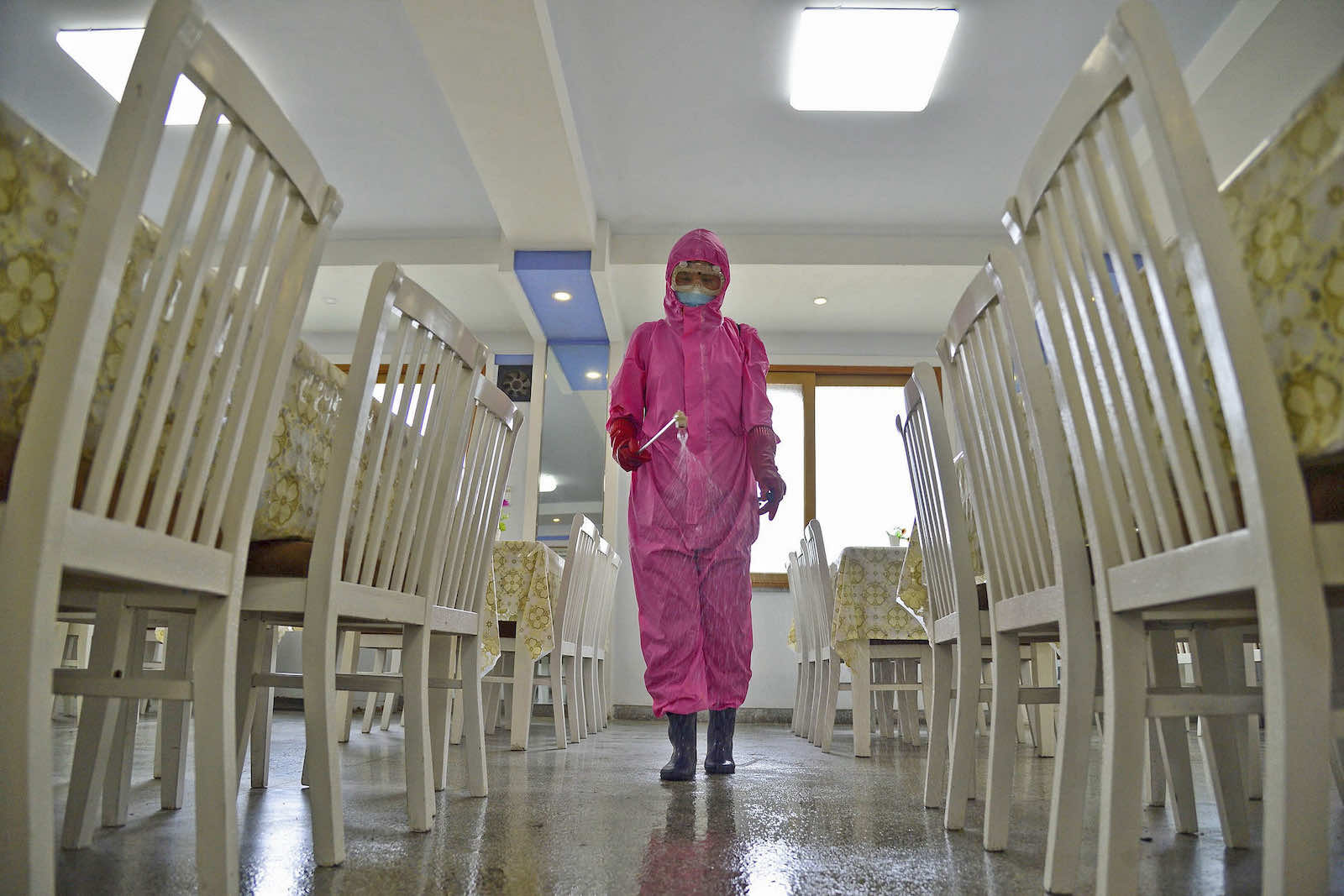 Disinfecting a dining room at a sanitary supplies factory in Pyongyang on 16 May (Kyodo News via Getty Images)