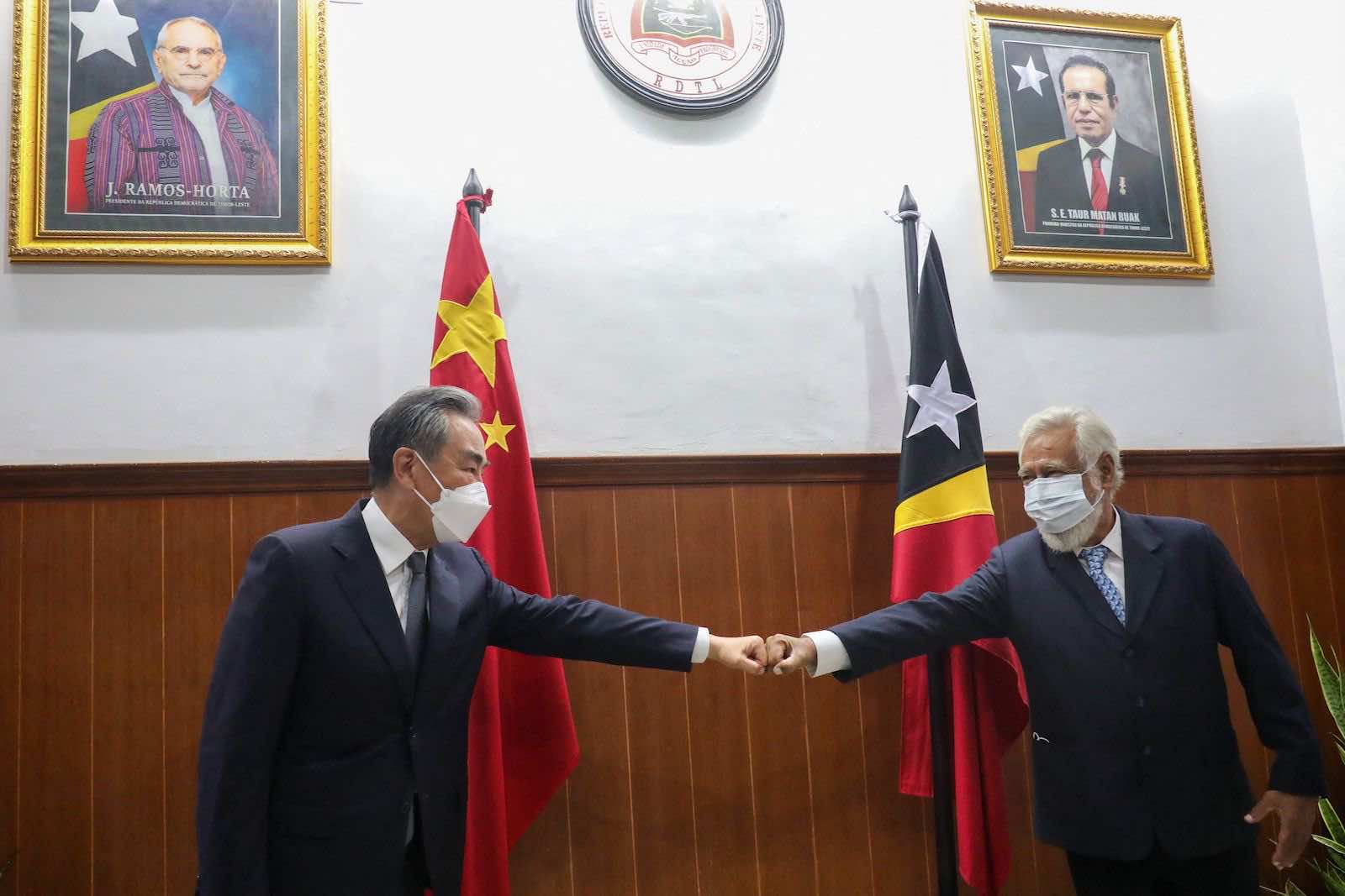 East Timor’s former leader Xanana Gusmao (right) greets China’s Foreign Minister Wang Yi during a meeting in Dili on 4 June (Valentino Dariel Sousa/AFP via Getty Images)
