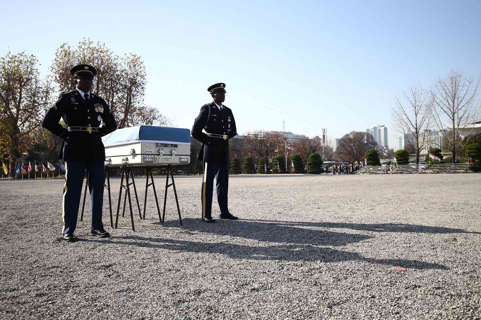United Nations Command honour guards stand with a coffin that contains the remains of a soldier who fought in the Korean war. Repatriation ceremony, Yangsan US military base, Seoul, 20 November 2018 (Chung Sung-Jun/Getty Images)