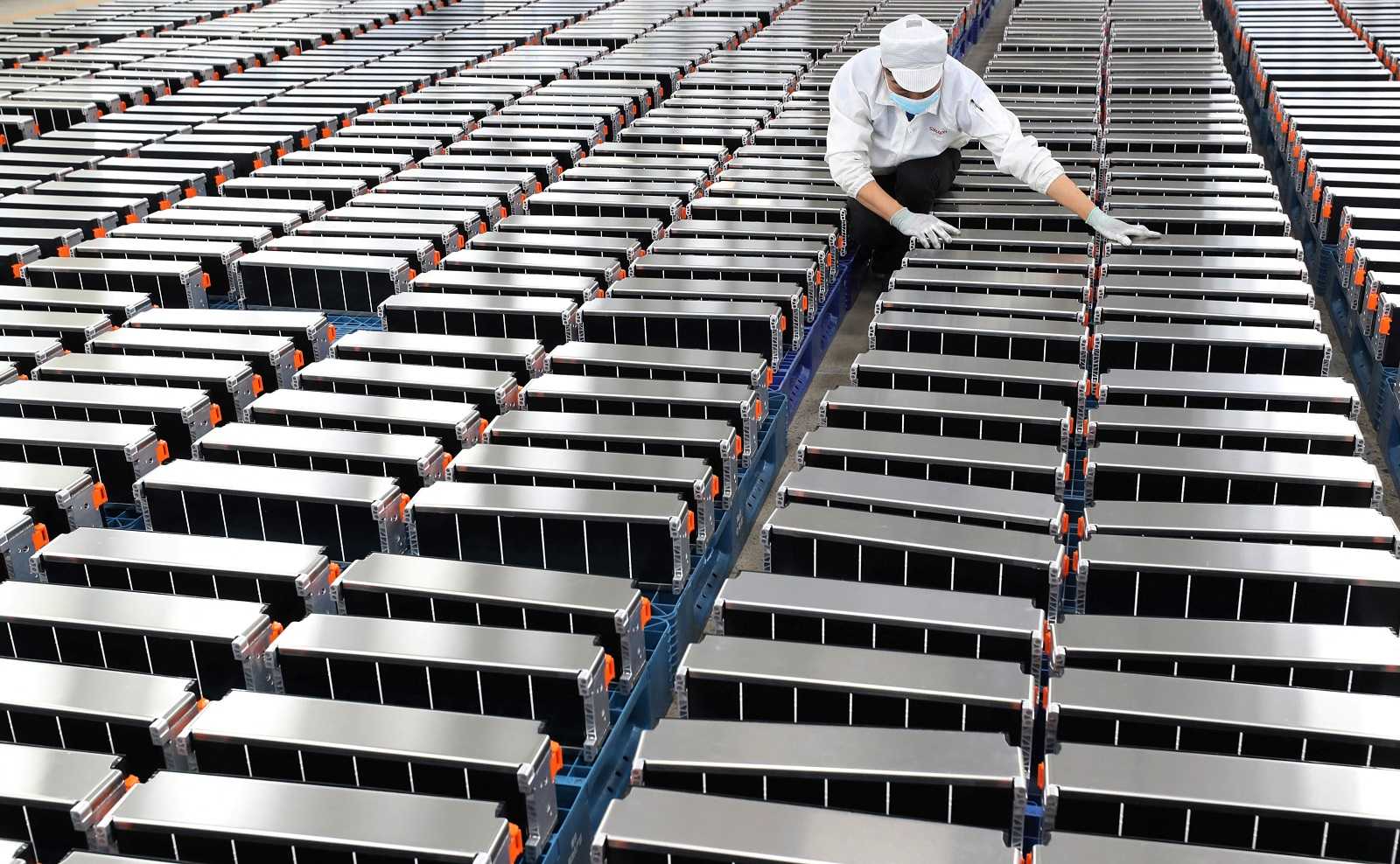 A worker at Xinwangda Electric Vehicle Battery Co Ltd, which makes lithium batteries, Nanjing, China, March 2021 (STR/AFP via Getty) 