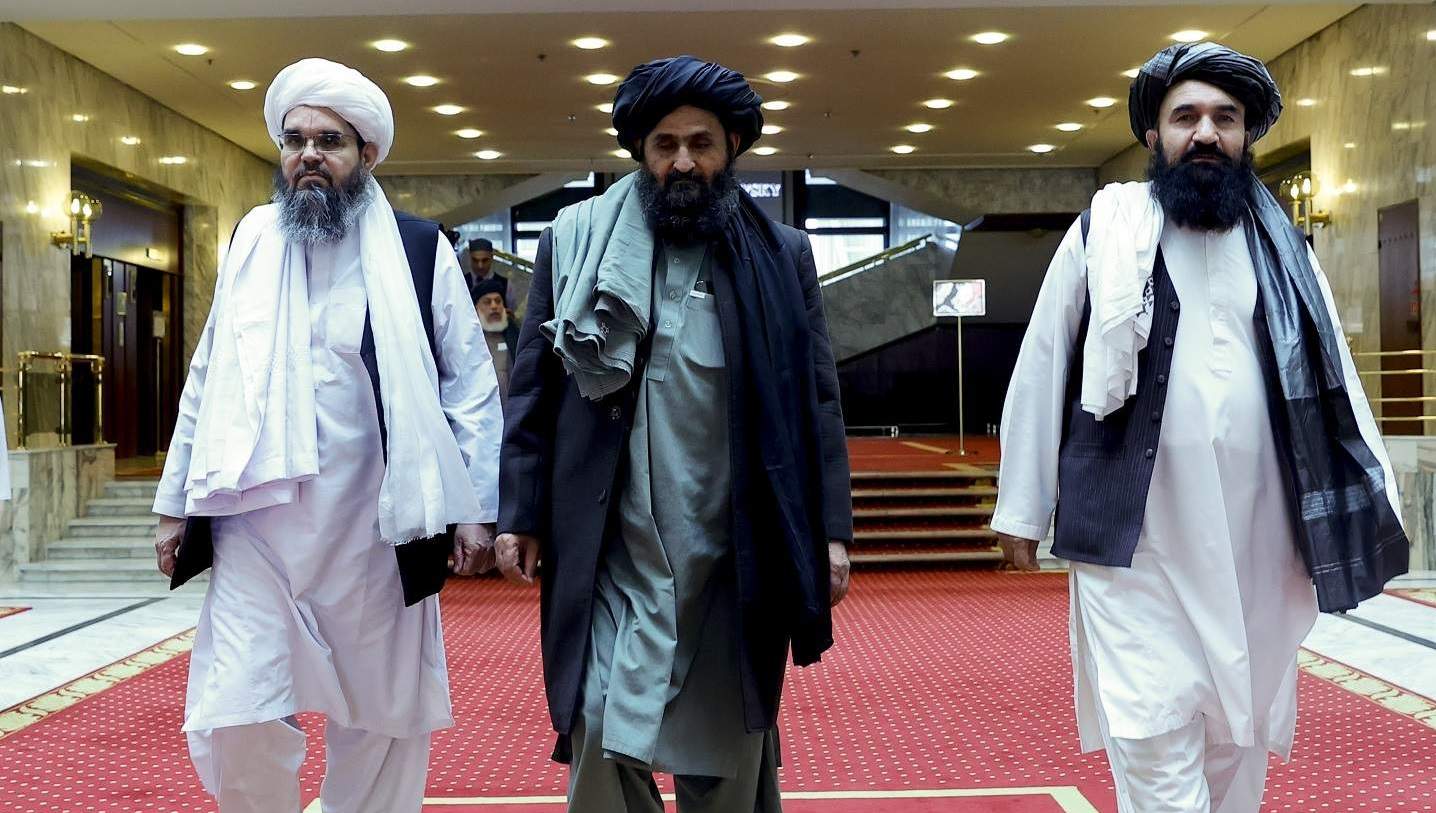 Taliban delegation headed by Abdul Ghani Baradar (C), leaving the Afghan peace meeting with delegates from Russia, China, US, Pakistan, Afghan parties and Qatar in Moscow, 19 March 2021 (Sefa Karacan/Anadolu Agency via Getty Images)