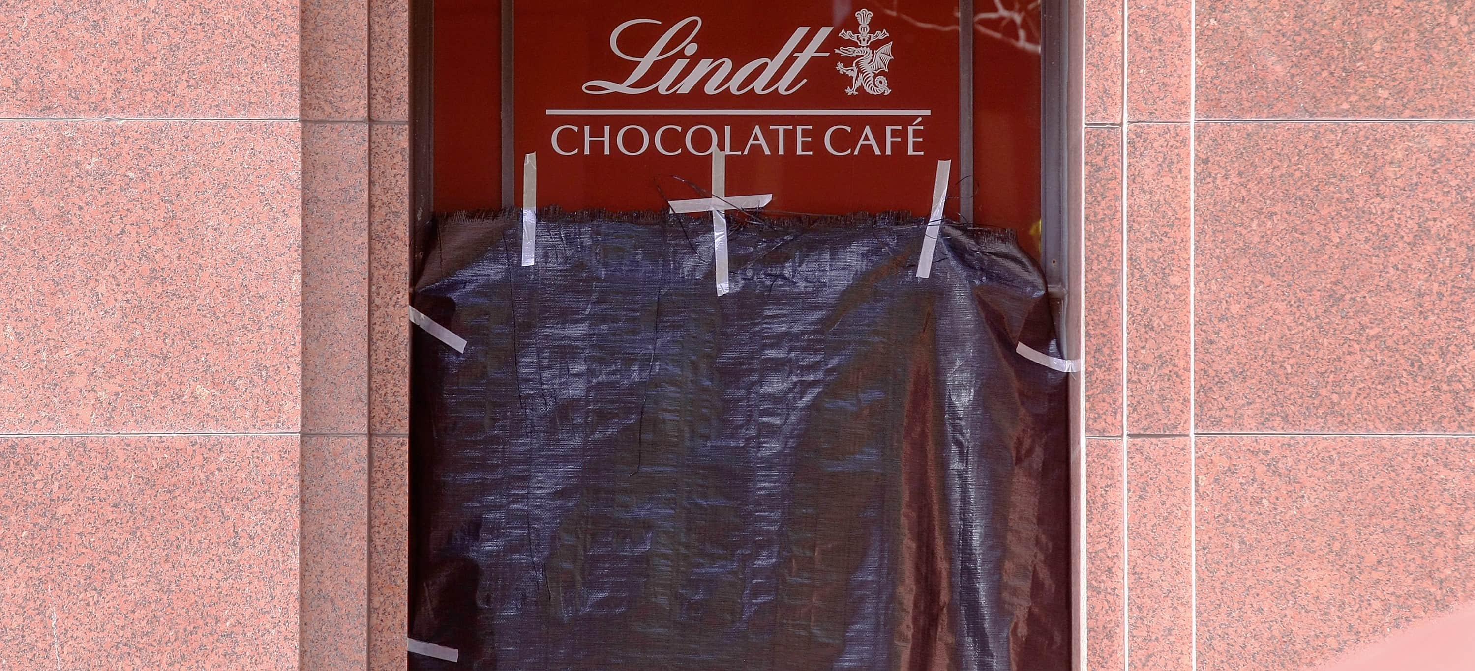 A window of Lindt Cafe in Sydney's Martin Place is covered with plastic on December 17, 2014 (Photo: Getty Images/Joosep Martinson)
