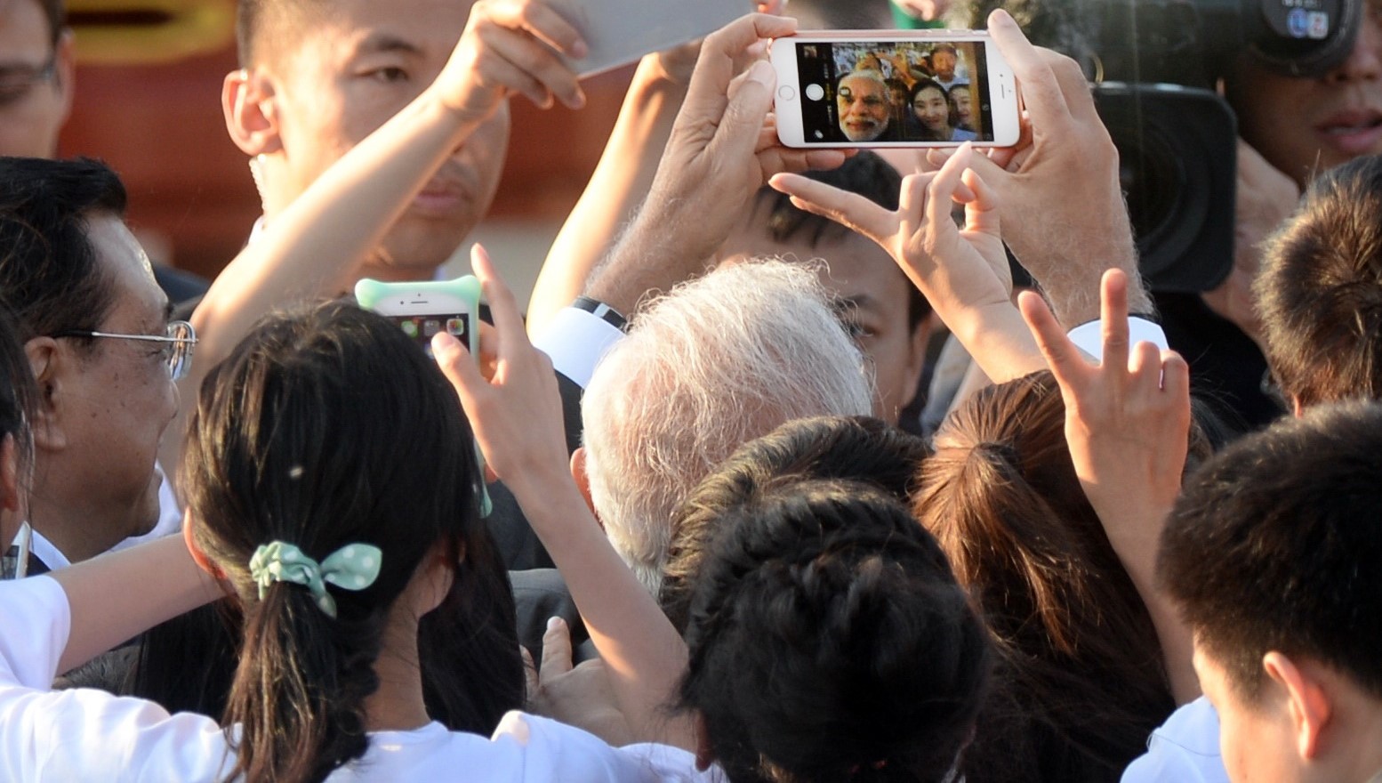 Indian Prime Minister Narendra Modi takes a selfie in Beijing, 2015 (Photo: Getty images/Pool)