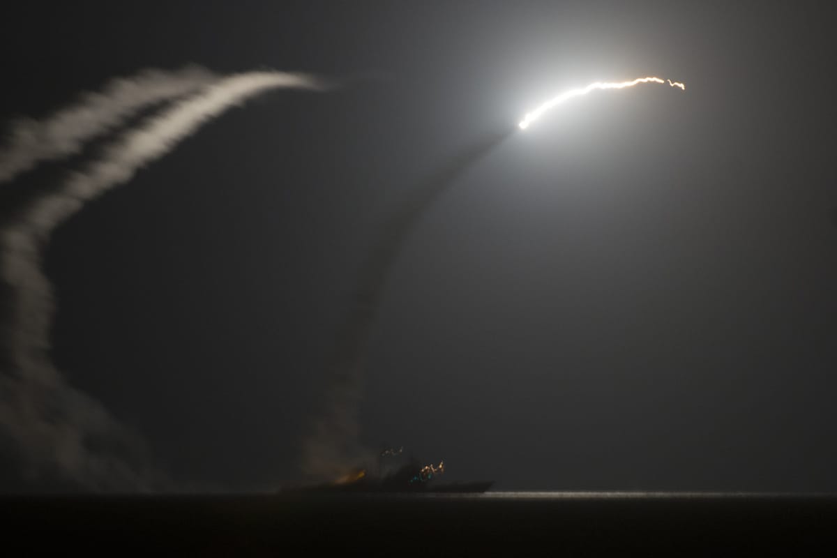 A US Navy warship launches cruise missiles strikes against Islamic State targets in 2014 (Eric Garst/US Navy)