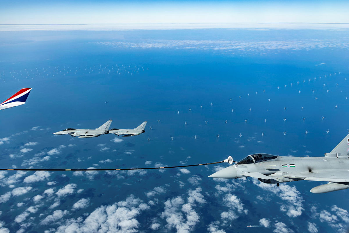 UK Royal Air Force Typhoons conduct an air-to-air refuel flight using sustainable aviation fuel last September over the North Sea with wind turbines below (Ryan Murray/Ministry of Defence)
