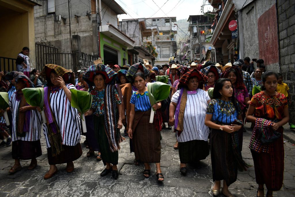 Mayan Tzutujil indigenous people take part in the Rilaj Mam (The great grandfather) procession in Santiago Atitlan, Guatemala, on 13 April 2022 (Johan Ordonez/AFP via Getty Images)