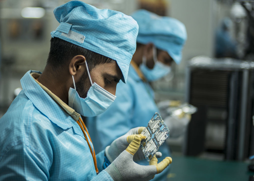 A smart phone factory in Noida, India (Anindito Mukerjee/Bloomberg via Getty Images)