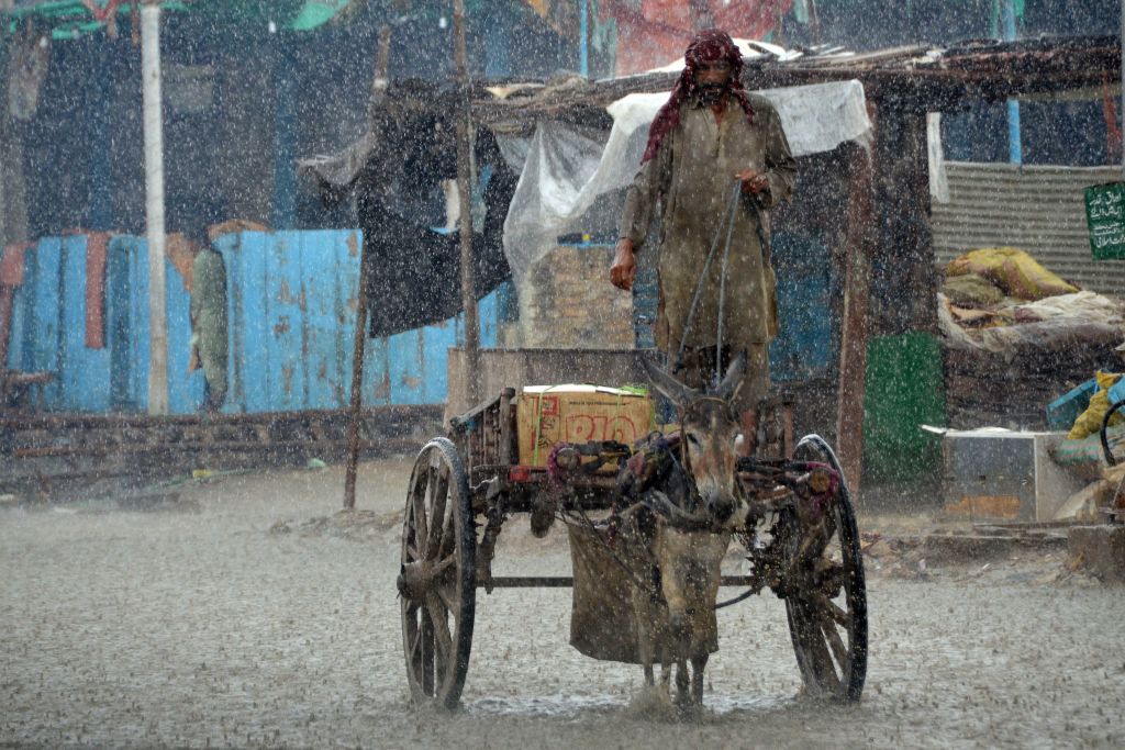 Heavy rainfall in the flood hit Dera Allah Yar town in Jaffarabad district, Balochistan province, Pakistan (Fida Hussain/AFP via Getty Images)