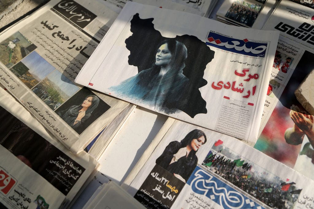 Newspapers in Tehran on 18 September covering the death of Amini after being arrested by morality police allegedly not complying with strict dress code in Iran (Fatemeh Bahrami/Anadolu Agency via Getty Images)