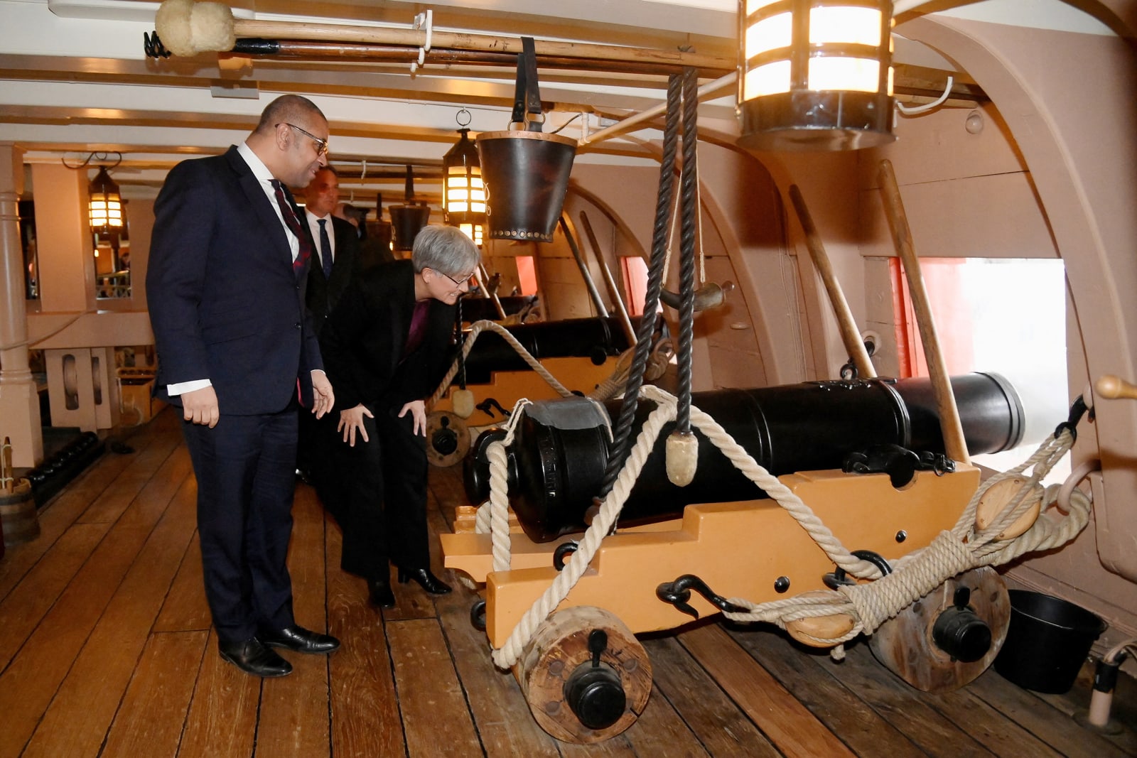 Australia's Foreign Minister Penny Wong and British Foreign Secretary James Cleverly view a cannon on the gun deck of British warship HMS Victory in Portsmouth, England (Toby Melville via Getty Images)