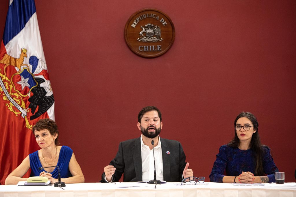 Chilean President Gabriel Boric, centre, with Interior Minister Carolina Toha, left, and the Minister Spokesperson for the Government, Camila Vallejos (Lucas Aguayo Araos/Anadolu Agency via Getty Images)