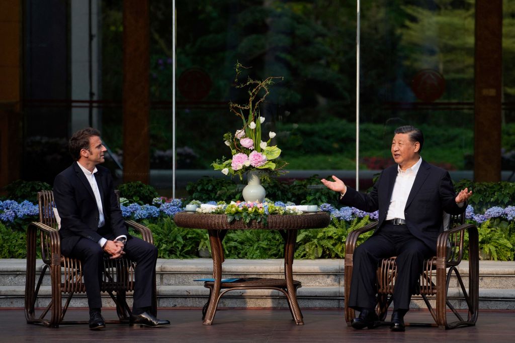 Macron and Xi at the Guandong province governor's residence in Guangzhou on 7 April (Thibault Camus/AFP via Getty Images)