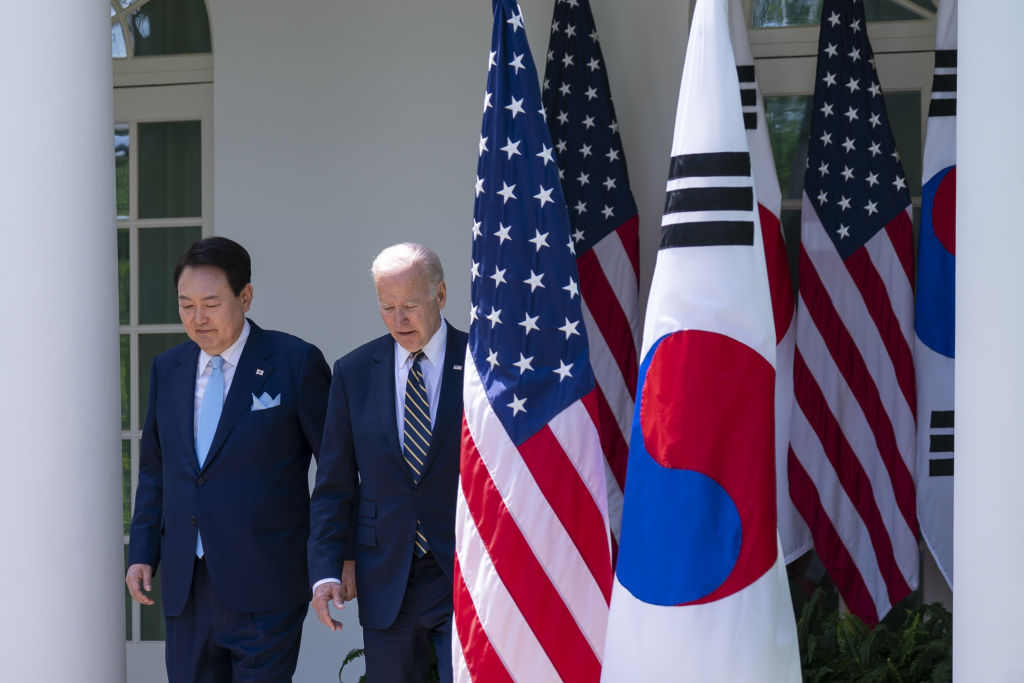 South Korea’s president Yoon Suk-yeol and US President Joe Biden arrive to a news conference in the Rose Garden of the White House on Tuesday (Sarah Silbiger/Bloomberg via Getty Images)