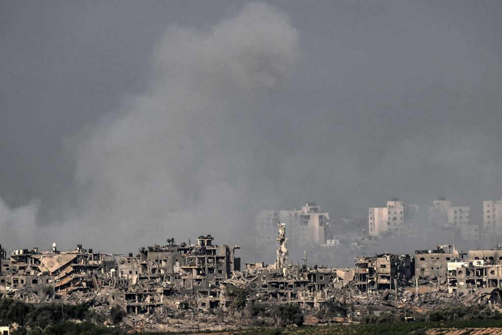 Buildings destroyed by Israeli bombardment against the Gaza skyline amid ongoing battles between Israel and Hamas, 1 November 2023 (Yuri Cortez/AFP via Getty Images)