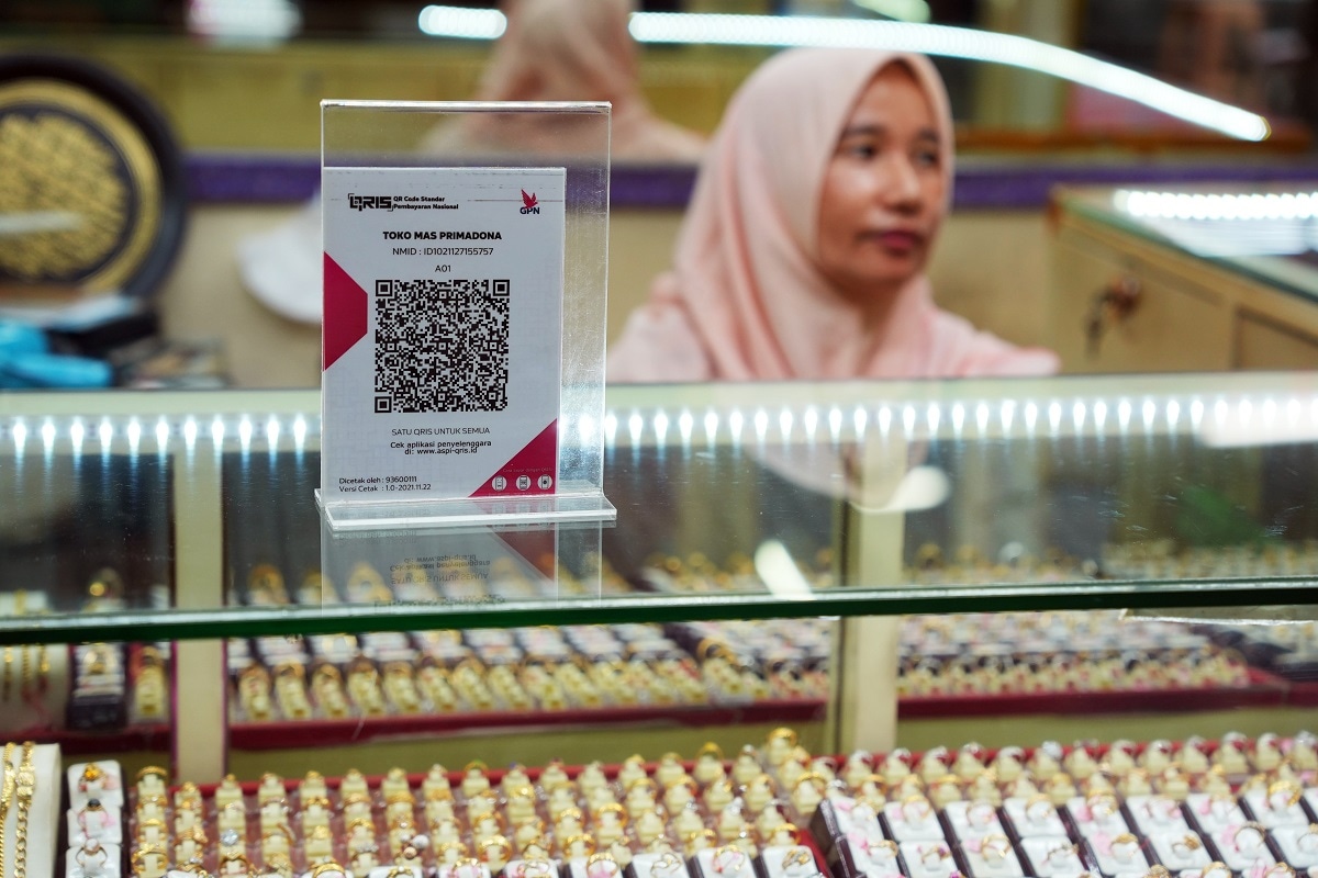 Editorial A Barcode Unlocks Indonesias Billion-Dollar Informal Economy A QR code for mobile payment is displayed at a jewelry store at Santa market in Jakarta, Indonesia, on Monday, Feb. 13, 2023. The uptake of QR code is paving the way for Indonesia to capture the billions of dollars of informal economic activity overlooked in taxation and even statistics due to small businesses reliance on cash. Photographer: Dimas Ardian/Bloomberg via Getty Images