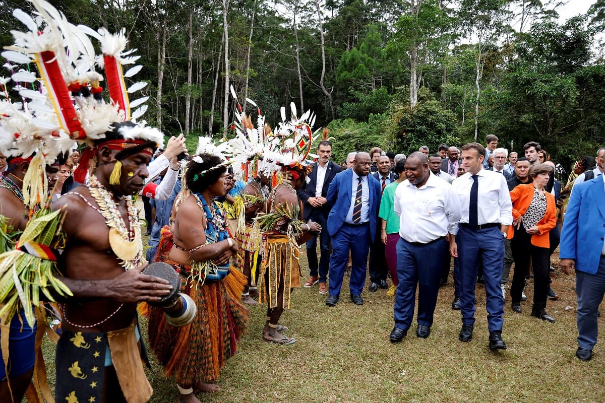 Prime Minister of Papua New Guinea James Marape (centre L) and France's President Emmanuel Macron (centre R) visit Varirata national park forest in Port Moresby on July 28, 2023. (Photo by Ludovic MARIN / AFP) (Photo by LUDOVIC MARIN/AFP via Getty Images)