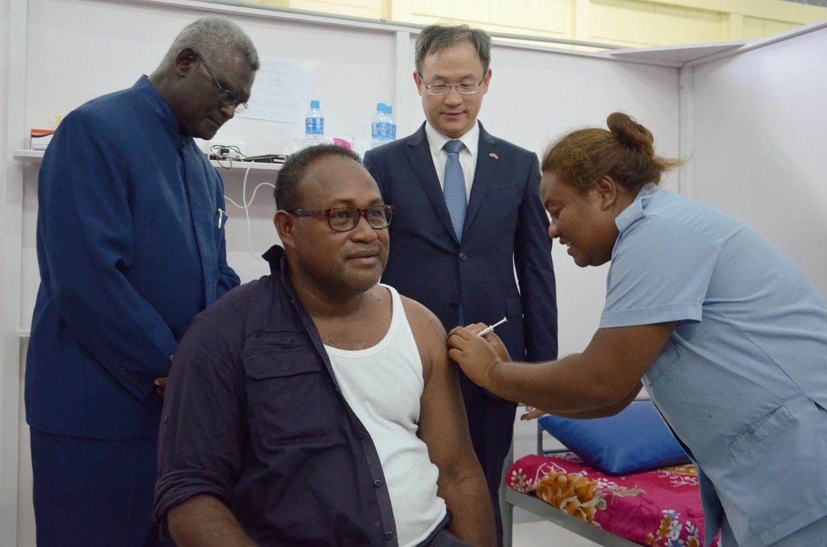 The Solomon Islands Deputy Prime Minister Manasseh Maelanga receives first jab during the vaccination launching ceremony for the Chinese-provided vaccines held at the Central Field Hospital in Honiara, the Solomon Islands on May 21, 2021. The Solomon Islands started to inoculate China's Sinopharm COVID-19 vaccines on Friday with Deputy Prime Minister Manasseh Maelanga being the first one to receive the jab on site. (Photo by Xinhua via Getty Images)