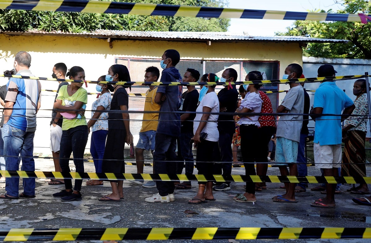 People wait in line to cast their ballots during the presidential election in Dili, Timor Leste on March 19, 2022. Timor Leste held a presidential election on Saturday. There are 16 candidates competing in the election, including the incumbent president Francisco Guterres, Nobel Prize laureate Jose Ramos-Horta and former Catholic priest Martinho Germano da Silva Gusmao. (Photo by Amori Zedeao/Xinhua via Getty Images)