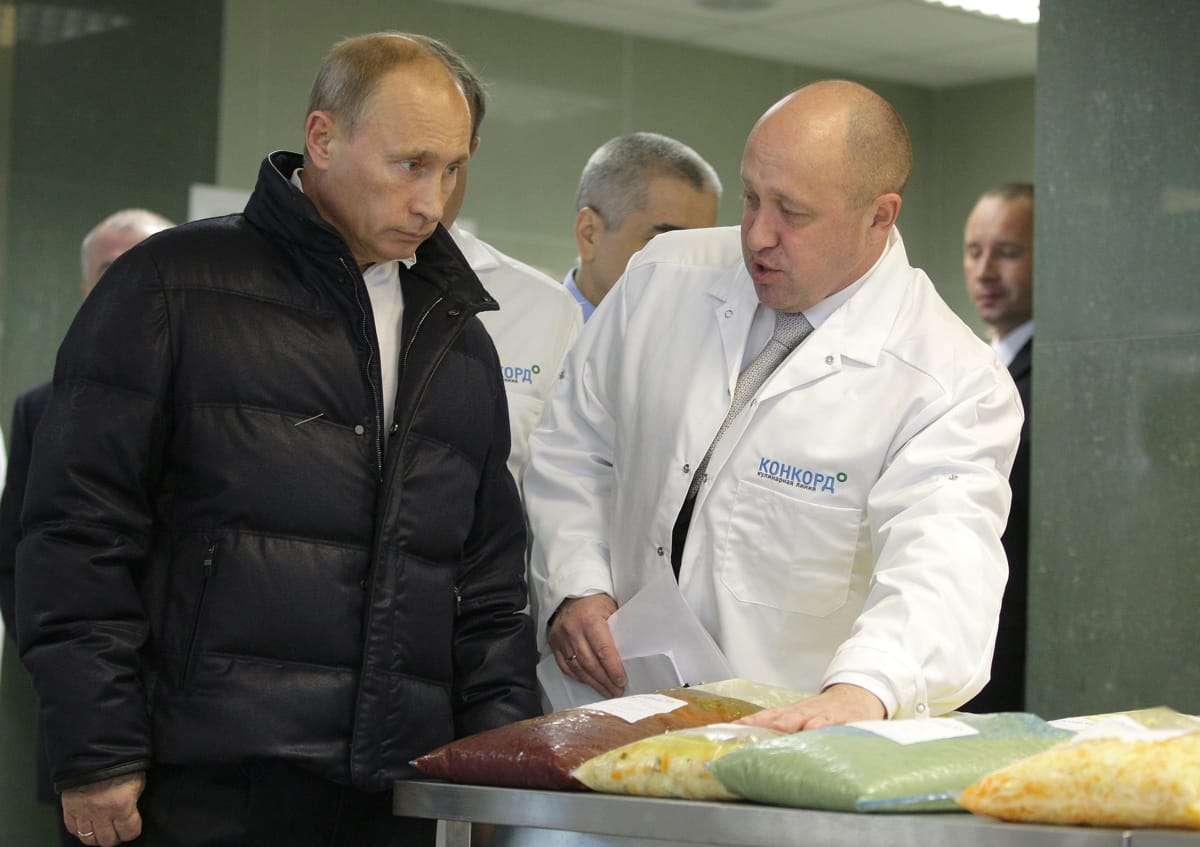 Putin and Prigozhin at a food factory in 2010 (Russian government via Wikimedia commons)