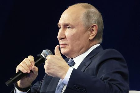 Putin steps abroad, even as an international warrant hangs over his head