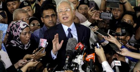 Najib charged, Mahathir wins