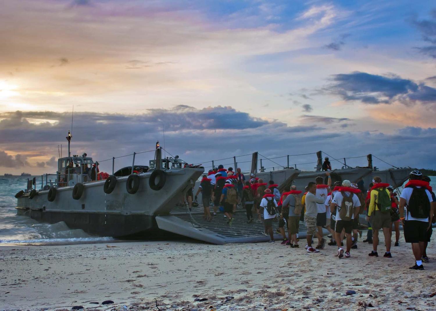 US personnel boarding a landing craft for a tip-to-tip bike ride around Diego Garcia (US Pacific Fleet/Flickr)