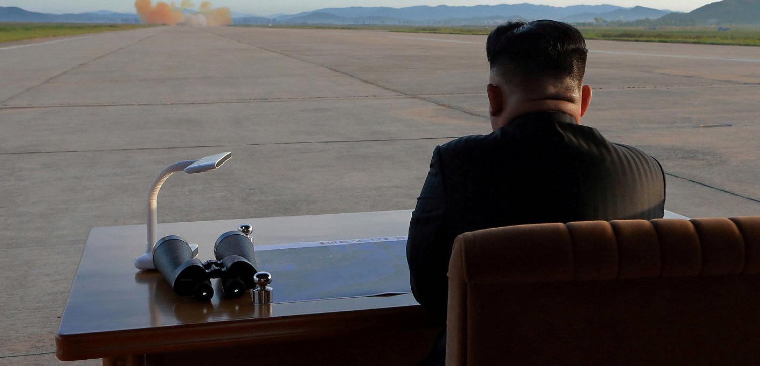 North Korean leader Kim Jong Un watches the launch of a Hwasong-12 missile in this undated photo released by North Korea's Korean Central News Agency, September 2017