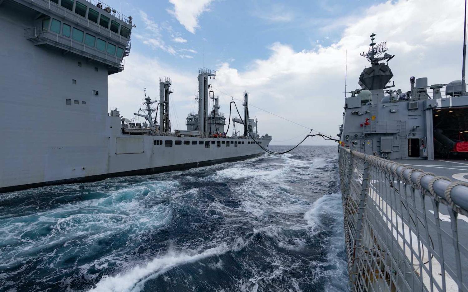 HMAS Ballarat (right) and Indian Naval Ship Shakti conduct a replenishment at sea during Exercise Malabar, November 2020 (Defence Department)