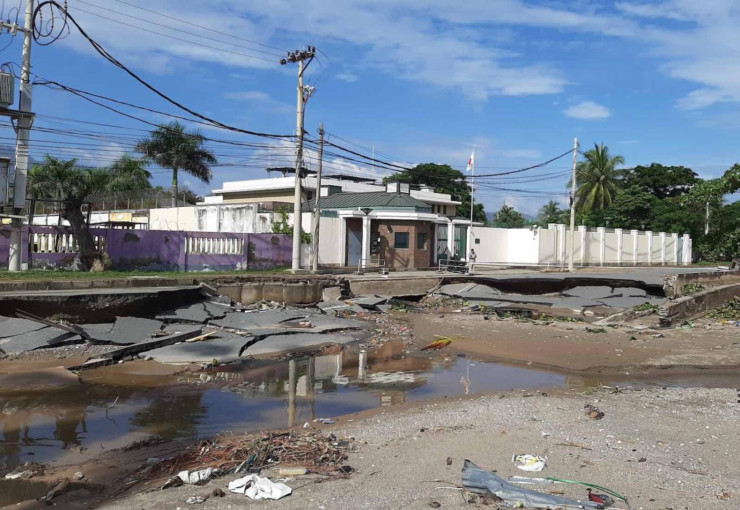Collapsed road in front of the Embassy of Japan in Dili after recent floods (Author provided)
