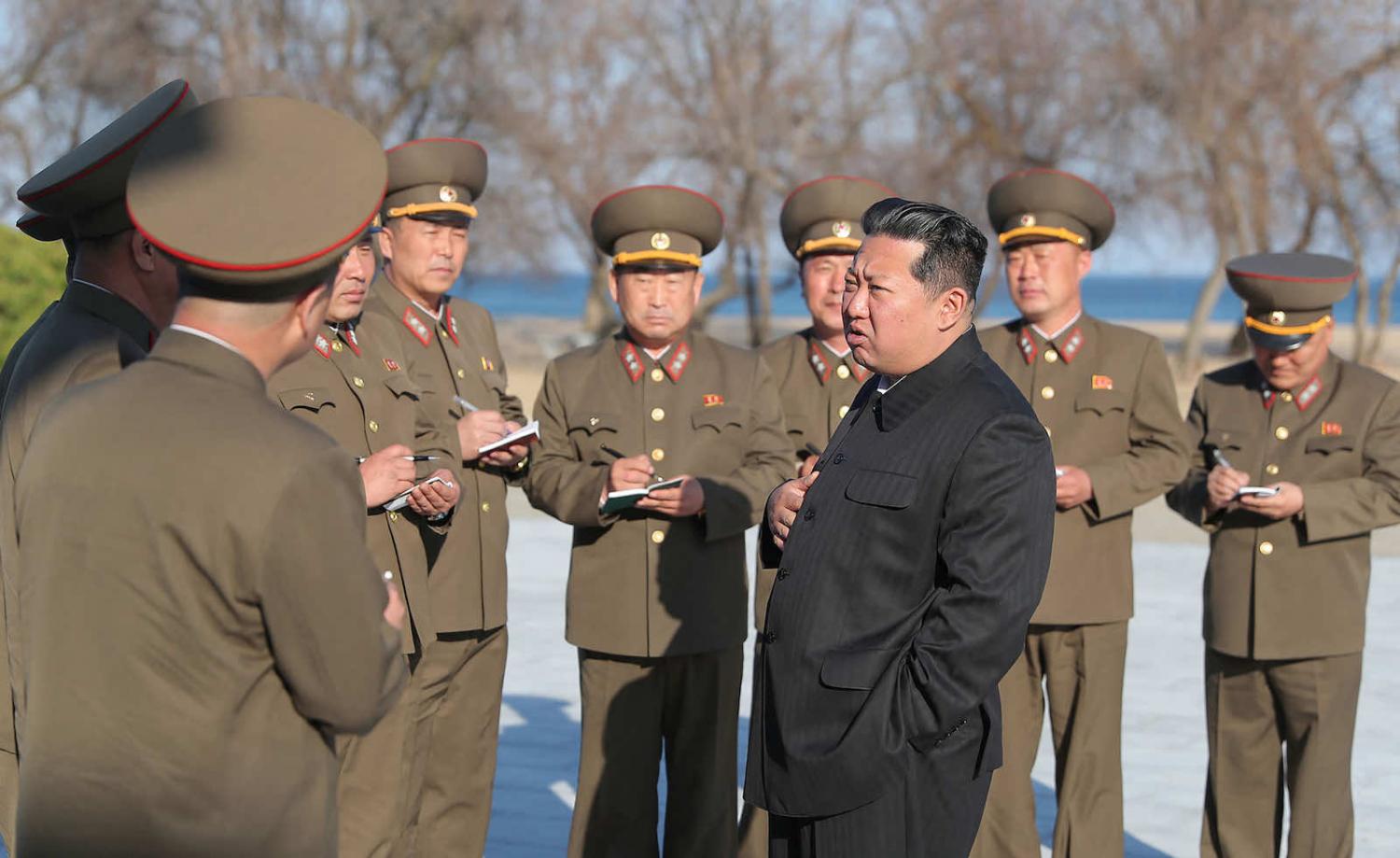 North Korea’s Kim Jong-un and his generals in a photo released in April (KCNA/AFP via Getty Images)