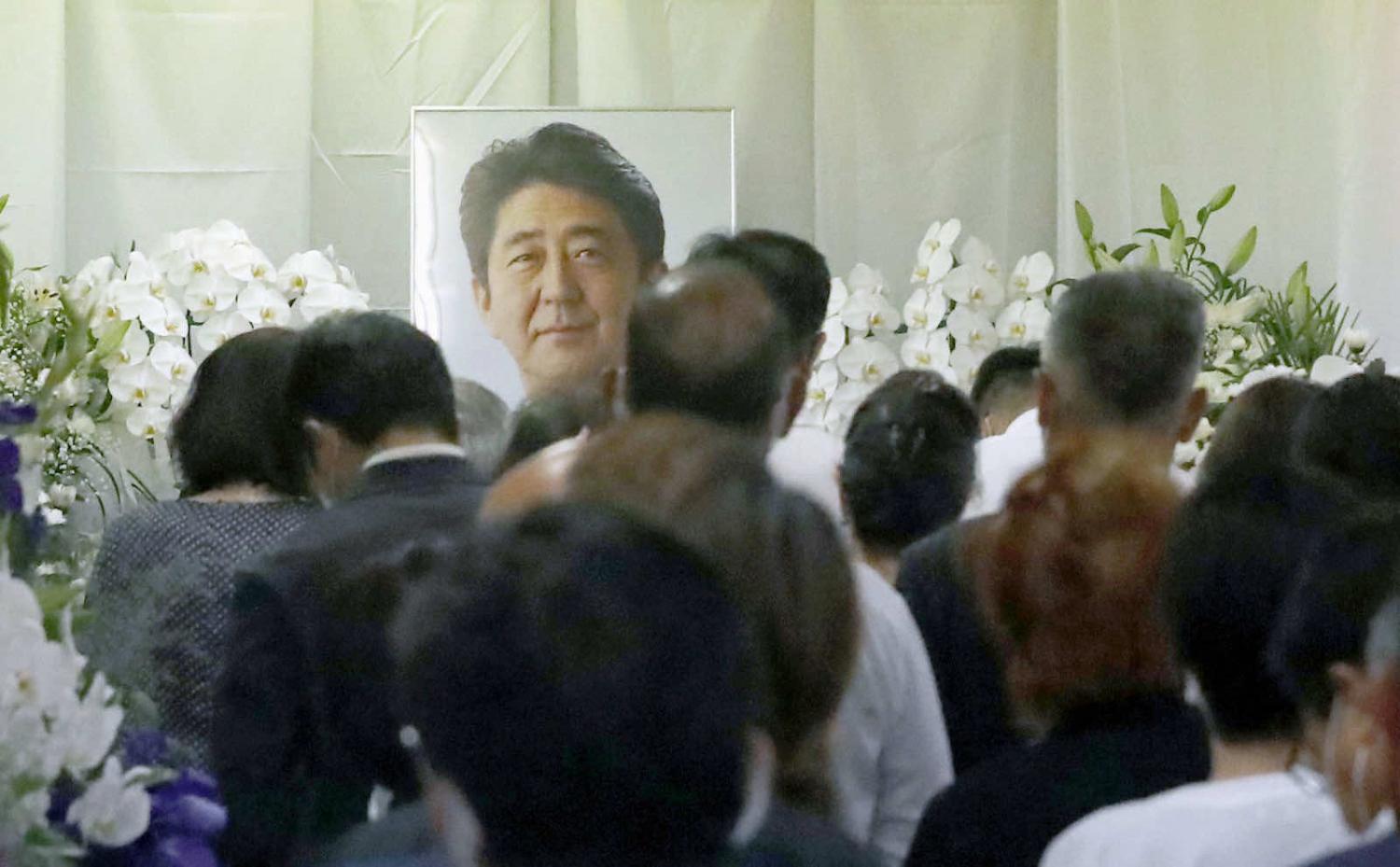 A memorial for Japan’s slain former prime minister Abe Shinzo in Shimonoseki, Yamaguchi Prefecture, his electoral base, on 12 July (Kyodo News via Getty Images)