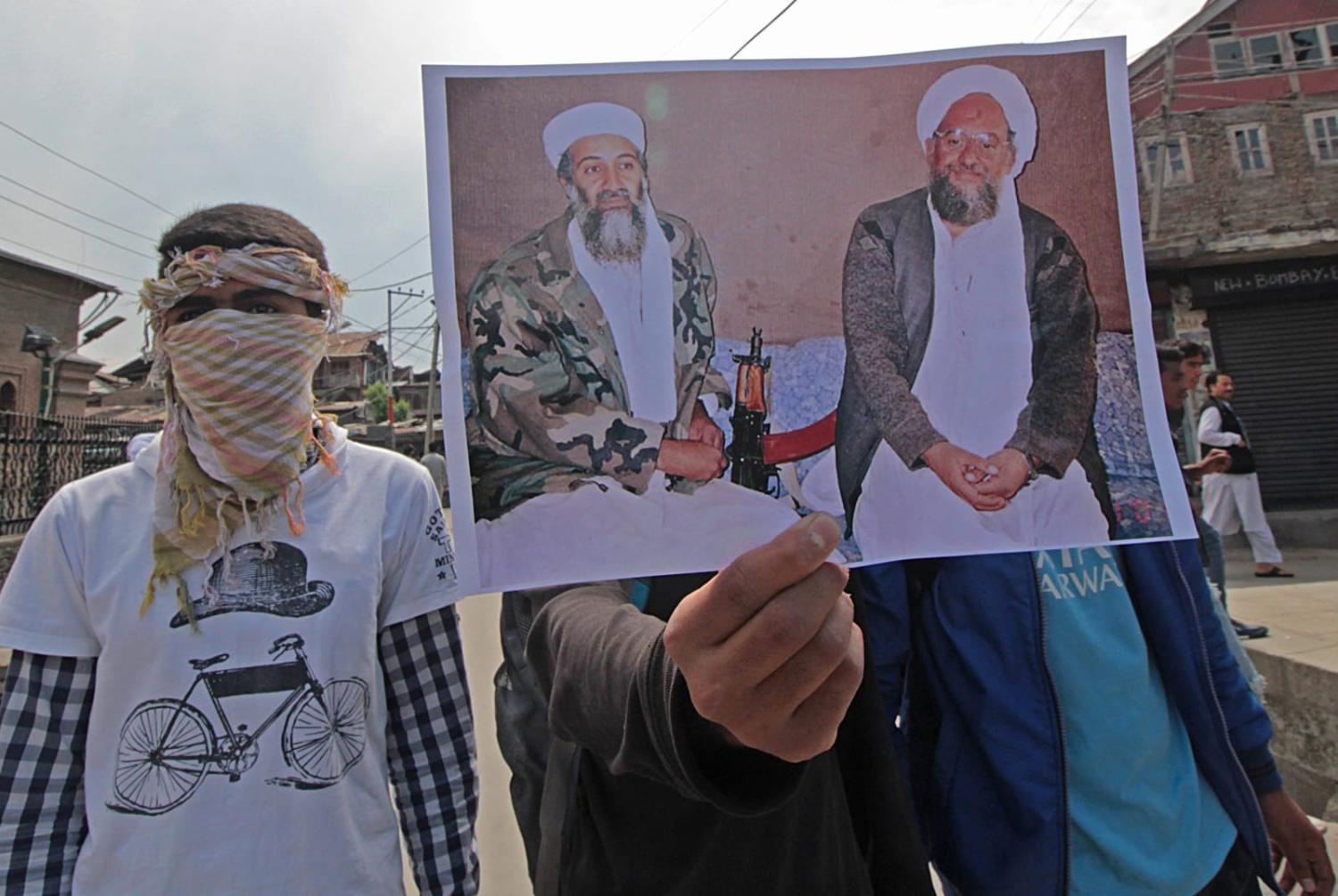 Protesters displaying a photo of Osama Bin Laden and Ayman al-Zawahiri during a demonstration in Srinagar, India (Faisal Khan via Getty Images)