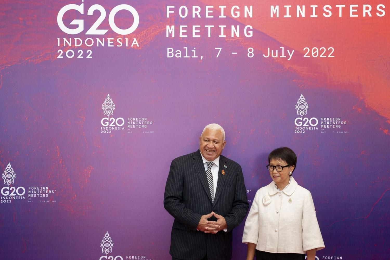 Indonesian Foreign Minister Retno Marsudi with Fijian Prime Minister Frank Bainimarama at the G20 Foreign Ministers Summit in Nusa Dua, Bali on 8 July 2022 (Stefani Reynolds/Pool/AFP via Getty Images)