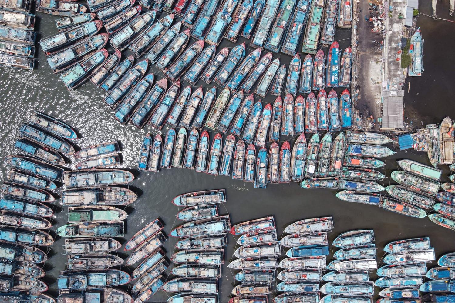 Fishing boats moored at a pier in Jakarta (Bay Ismoyo/AFP via Getty Images)