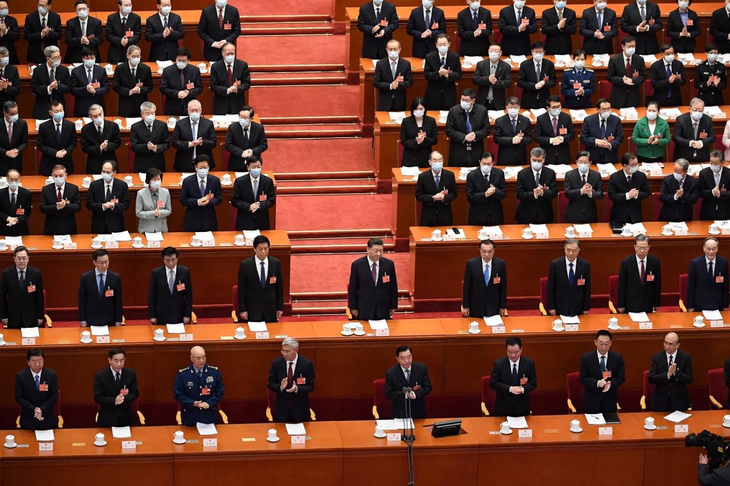 China’s President Xi Jinping (C) attends the National People’s Congress with Chinese leaders and delegates at the Great Hall of the People in Beijing, 8 March 2022 (Leo Ramirez/AFP via Getty Images)