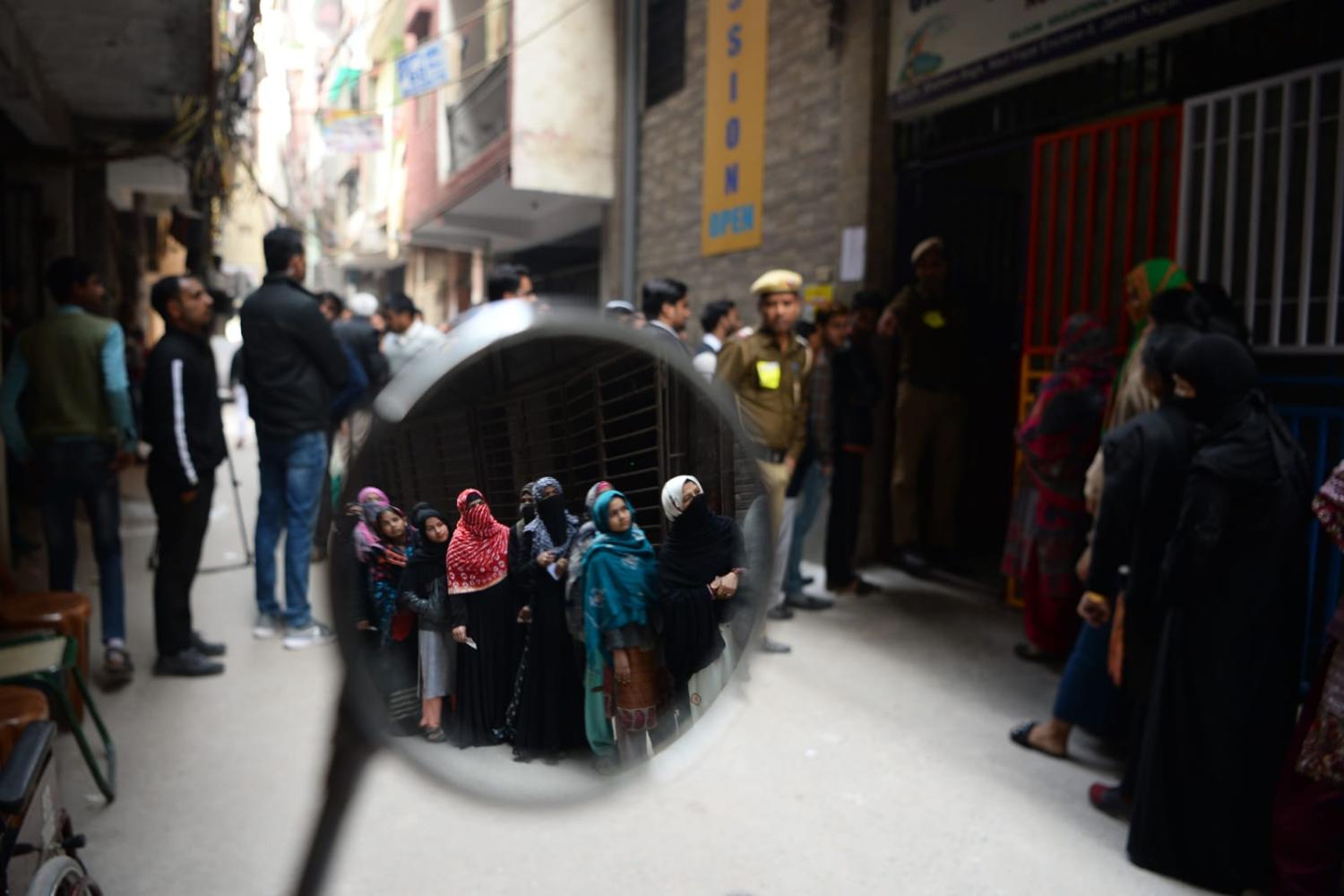 Voters queue at a polling station during the 2020 Legislative Assembly elections in New Delhi (Sajjad Hussain/AFP via Getty Images)